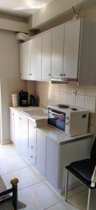 Kuchyň nebo kuchyňský kout v ubytování SeaSide Apartment Rio