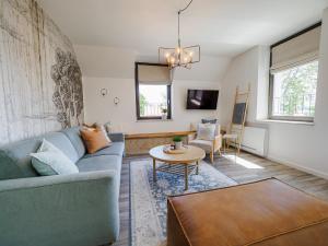 Televízia a/alebo spoločenská miestnosť v ubytovaní Malom és Kacsa Boutique Hotel