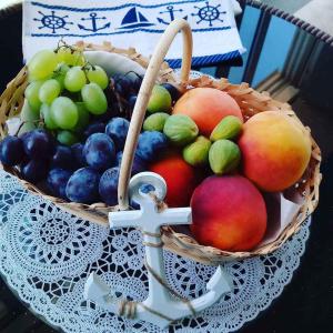 a basket of fruit sitting on a table at Apartment Nova Vas/Porec 2 in Nova Vas