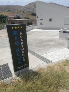 a sign in front of a parking lot at Big Blue - Xenija (Veliko Plavetnilo - Ksenija) in Metajna