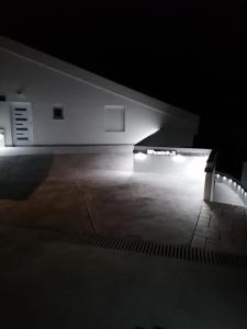 a dark room with a bench in the dark at Big Blue - Xenija (Veliko Plavetnilo - Ksenija) in Metajna