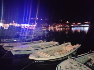 a group of boats docked in a harbor at night at Big Blue - Xenija (Veliko Plavetnilo - Ksenija) in Metajna
