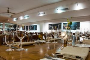 a table in a restaurant with wine glasses on it at IMPULSIV Hotel & Sportresort in Lörrach