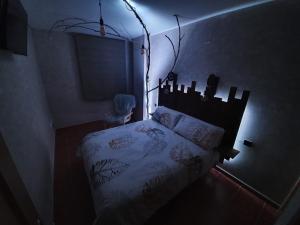 Un pat sau paturi într-o cameră la El Balcón del Espigüete