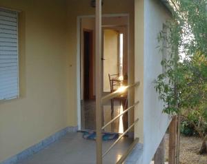 a glass door of a house with a window at Apartment Zlarin 1 in Zlarin