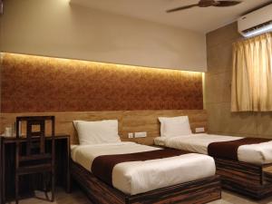 Ένα ή περισσότερα κρεβάτια σε δωμάτιο στο Icon Residency