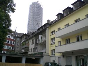 a view of the towers from the courtyard of a building at Schönes Apartment in Essen in Essen