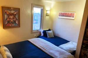 a small room with a bed and a window at Hot Tub & Sauna PEAK 8 BRECKENRIDGE in Breckenridge