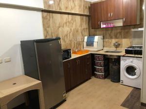 A kitchen or kitchenette at Amazing Chalet at Bluebay Asian Resort Pool View - Families Only