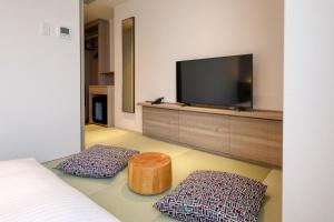 TV a/nebo společenská místnost v ubytování Glocal Hotel Itoshima
