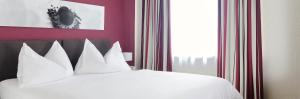 Katil atau katil-katil dalam bilik di Hotel Hottingen