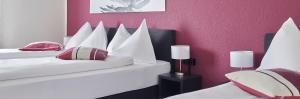 Katil atau katil-katil dalam bilik di Hotel Hottingen