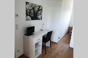 TV a/nebo společenská místnost v ubytování Comfy Plaza