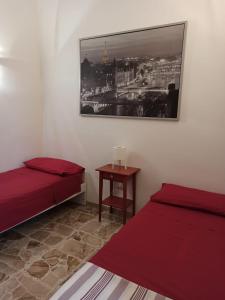 A bed or beds in a room at La casa di Mimì... calore e accoglienza!