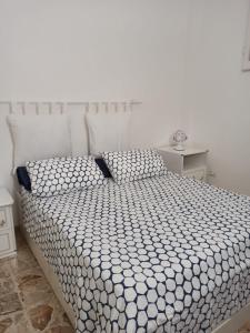 A bed or beds in a room at La casa di Mimì... calore e accoglienza!