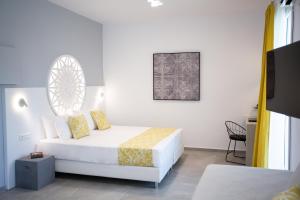 Ein Bett oder Betten in einem Zimmer der Unterkunft Likio Studios