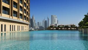 a large body of water in front of a city at The Address Dubai Mall Residence Burj Khalifa View 3 in Dubai