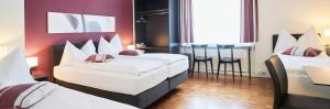 Katil atau katil-katil dalam bilik di Hotel Hottingen