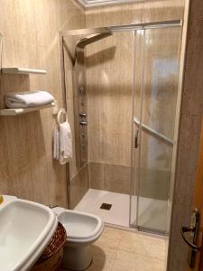 Ванная комната в Apartamentos en Playa de Samil Primera Línea de playa Pe Na Areia