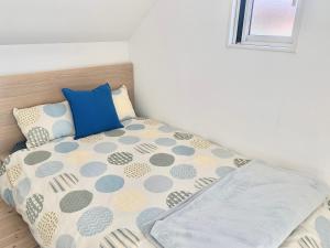 Postel nebo postele na pokoji v ubytování 那須塩原にある貸別荘 レンガの家Ｓｏｒａ