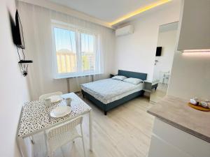 Łóżko lub łóżka w pokoju w obiekcie Center Warsaw- Apartamenty Smolna