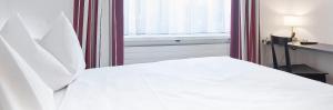 Katil atau katil-katil dalam bilik di Hotel Hottingen