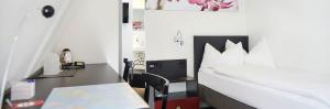 Katil atau katil-katil dalam bilik di Hotel Hottingen