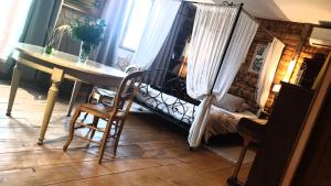 Postel nebo postele na pokoji v ubytování Chambre d'hôtes Le Petit Ranch