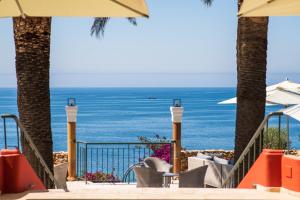 a view of the ocean from a resort patio at Boutique Hotel Vivenda Miranda in Lagos
