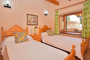 Ένα ή περισσότερα κρεβάτια σε δωμάτιο στο 014 Finca Cantabou ETV2728 by Mallorca Charme +28 φωτογραφίες