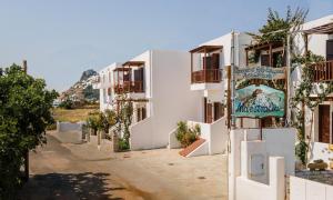 a building with a sign on the side of it at Maestralia in Skiros