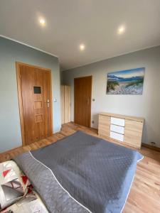 Posteľ alebo postele v izbe v ubytovaní Apartamenty Studio 2 Orion Chłapowo