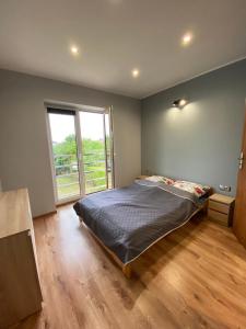 Posteľ alebo postele v izbe v ubytovaní Apartamenty Studio 2 Orion Chłapowo