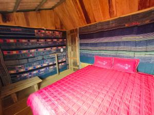 
Giường trong phòng chung tại Indigenous homestay
