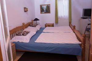 Posteľ alebo postele v izbe v ubytovaní Tókert Vendégház