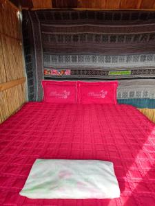 
Giường trong phòng chung tại Indigenous homestay
