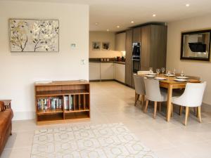 a kitchen and dining room with a table and chairs at The Wheatlands in Much Wenlock