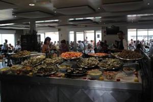 a buffet line with many different types of food at Holiday Home With Pool In Marseillan in Marseillan