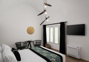 Krevet ili kreveti u jedinici u okviru objekta Allegro Suites Oia