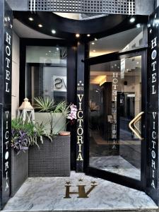 a store front with a sign that says k on it at Hotel Victoria in Florence