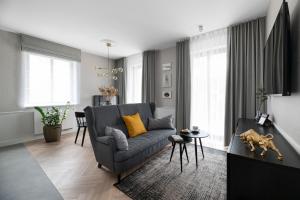 Televízia a/alebo spoločenská miestnosť v ubytovaní W Sercu Warszawy Apartamenty