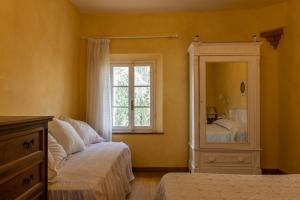 A bed or beds in a room at Agriturismo Percenna