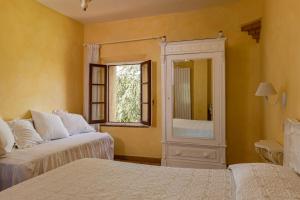 A bed or beds in a room at Agriturismo Percenna