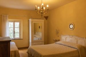 A bed or beds in a room at Agriturismo Percenna