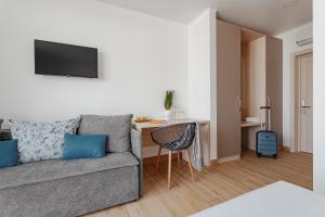 a living room with a couch and a table at Lucky Residence in Zatoka