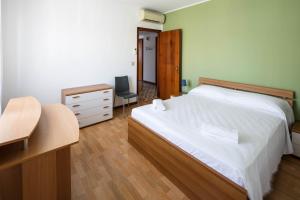 Ένα ή περισσότερα κρεβάτια σε δωμάτιο στο Appartamento Calmo 2DX