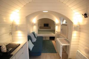a tiny house with a bed in a room at Kuldallika igloo house and iglusauna in Kullamäe +20 photos