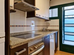 a kitchen with a sink and a counter top at Apartamento Completo Torresol III in Benidorm