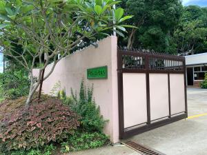a fence with a gate with a parking sign on it at Felicitas Tagaytay in Tagaytay