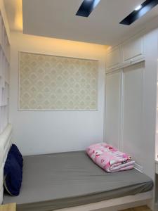 Łóżko lub łóżka w pokoju w obiekcie Saigon South Residence - Vina We Stay